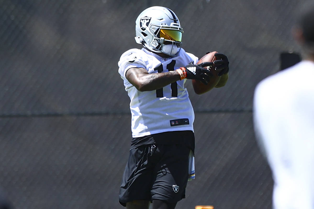 Raiders wide receiver Henry Ruggs III (11) catches a pass during NFL football practice at Raide ...