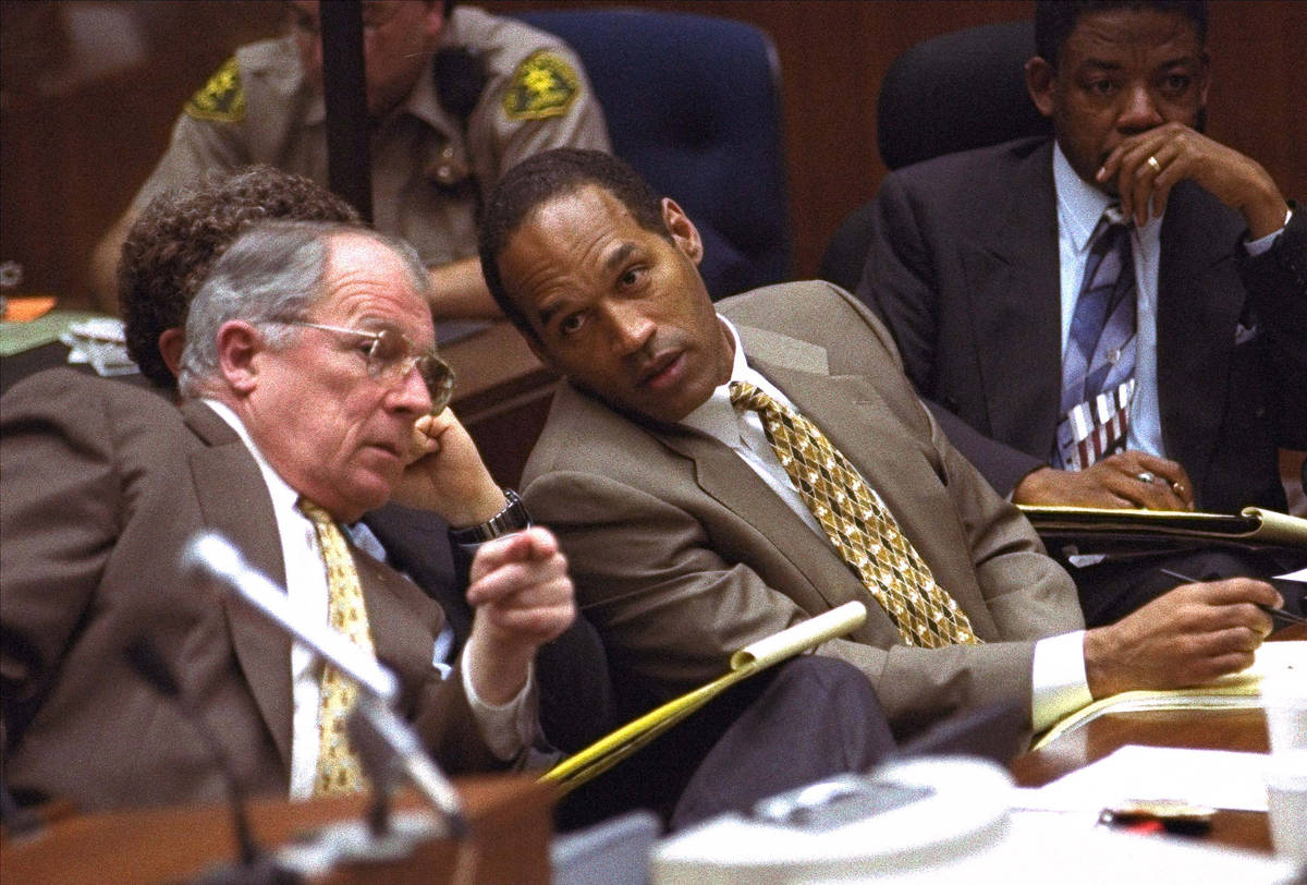 In this Friday, June 30, 1995, file photo, O.J. Simpson and defense attorney F. Lee Bailey, lef ...