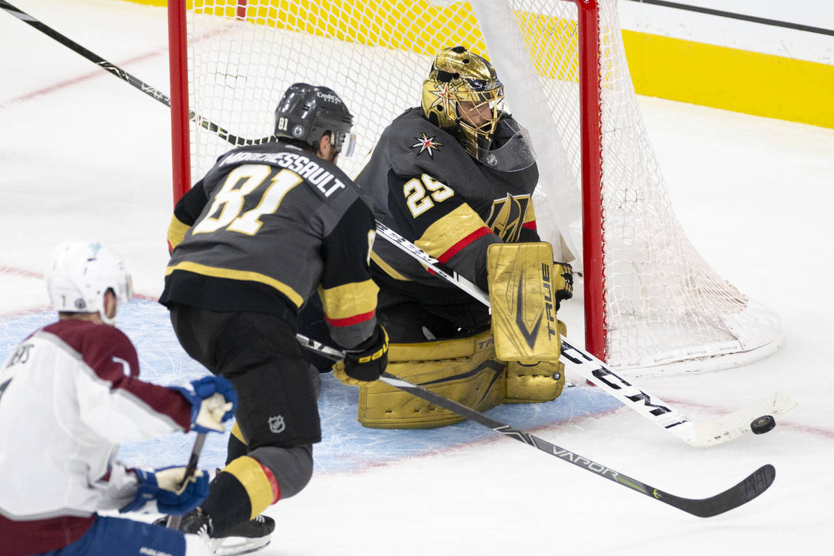 Golden Knights goaltender Marc-Andre Fleury (29) makes a save while center Jonathan Marchessaul ...