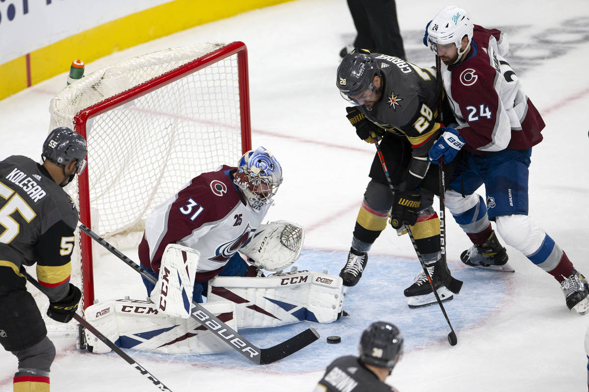 Avalanche goaltender Philipp Grubauer (31) makes a save on a shot by Golden Knights left wing W ...