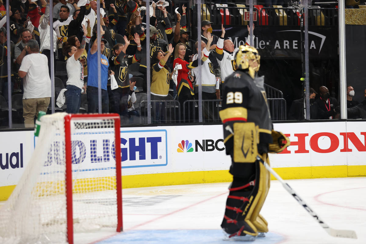 Fans celebrate a score by the Vegas Golden Knights against the Colorado Avalanche in the second ...