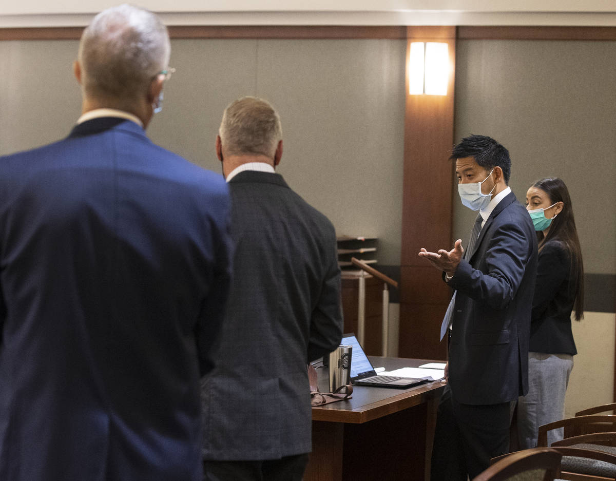 Defense attorneys David Anthony, left, and Brad Levenson, representing Zane Floyd, listen to pr ...