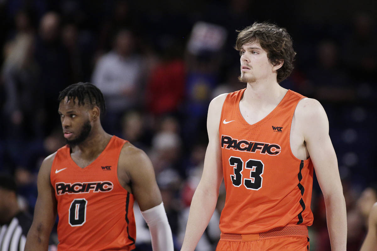 Pacific guard Jahlil Tripp (0) and center James Hampshire (33) walk on the court before the sec ...