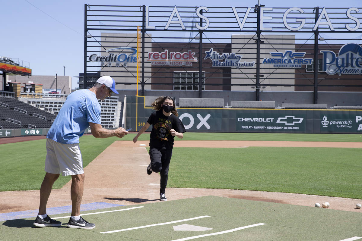 Avery Haren, 12, who just received the first dose of the Pfizer COVID-19 vaccination, reaches h ...