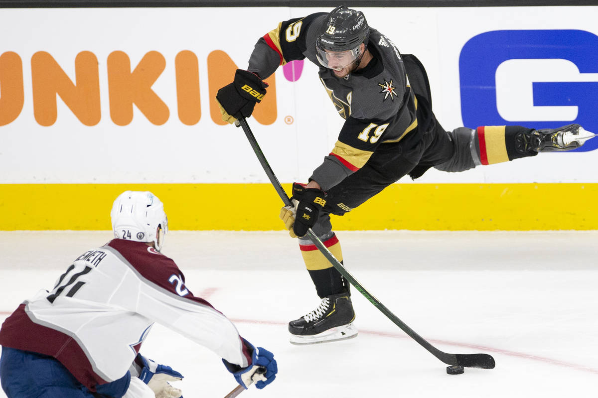 Golden Knights right wing Reilly Smith (19) makes an unsuccessful shot on goal while Avalanche ...
