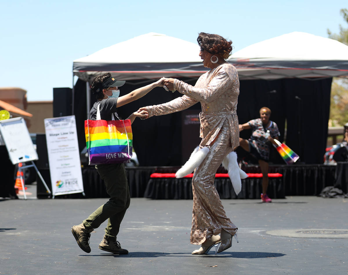 Anna Joy, left, dances with Midori Ice, right, current Miss Las Vegas Pride, at Pride Fest at t ...
