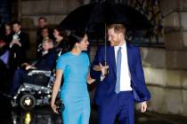 Britain's Prince Harry and Meghan, the Duke and Duchess of Sussex arrive at the annual Endeavou ...
