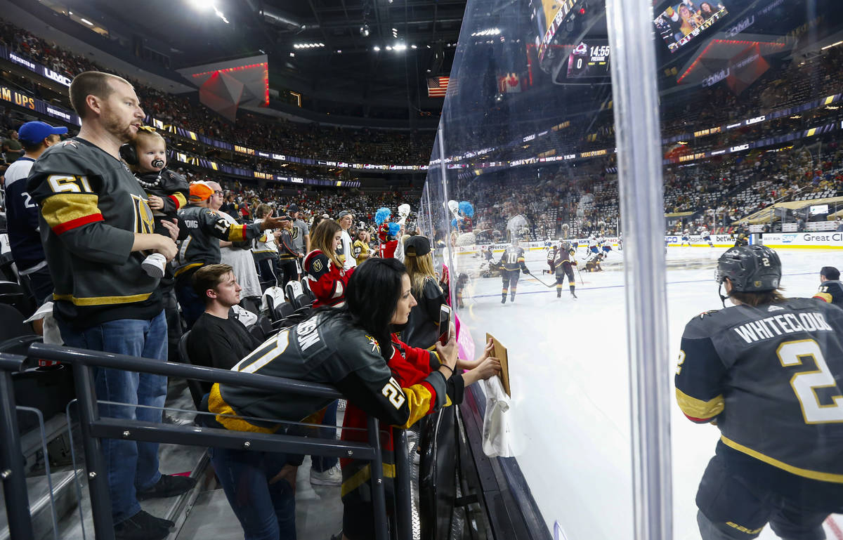 Golden Knights fans cheer as players warm up before Game 4 of an NHL hockey Stanley Cup second- ...