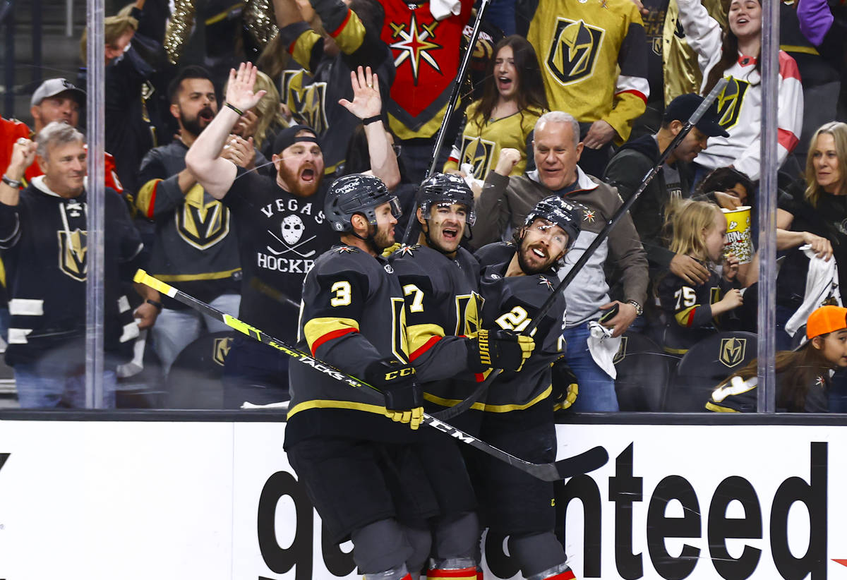 The Golden Knights' Max Pacioretty (67) celebrates his goal with Brayden McNabb (3) and Chandle ...