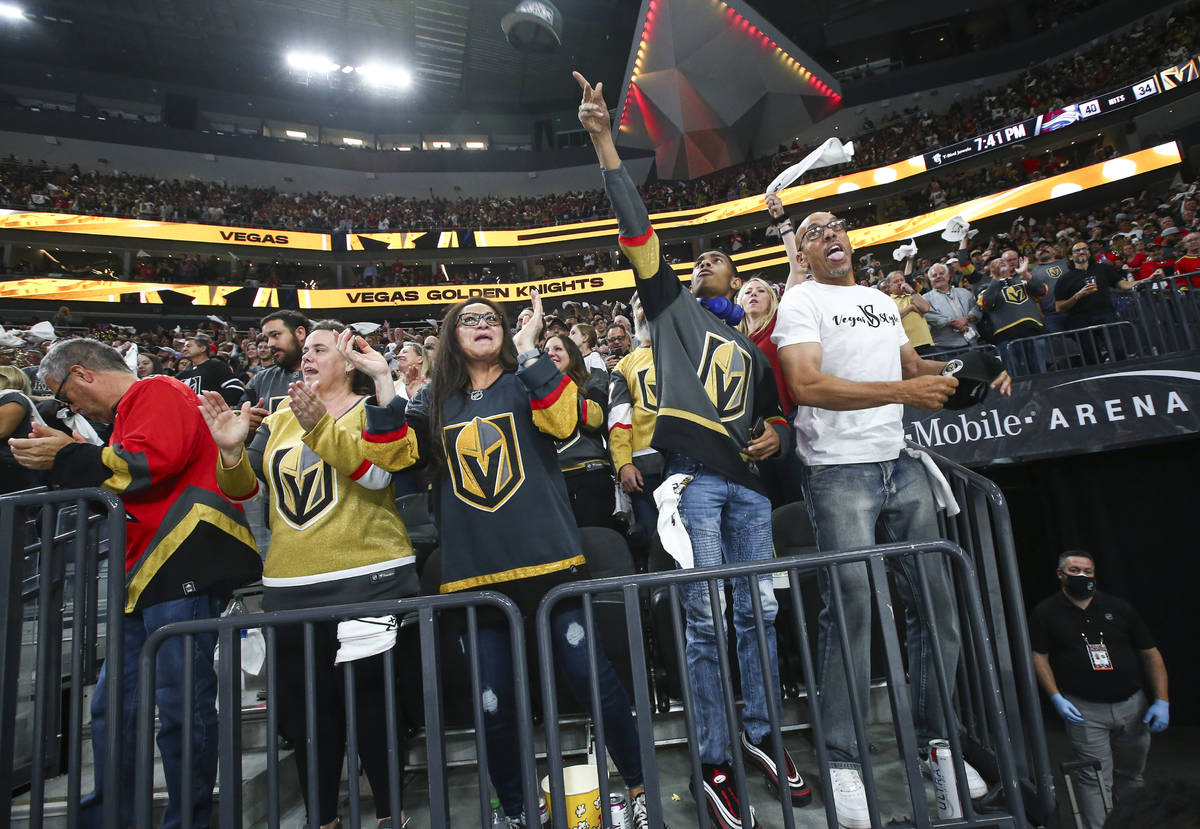 Golden Knights fans celebrate a hat trick by Jonathan Marchessault, not pictured, during the th ...