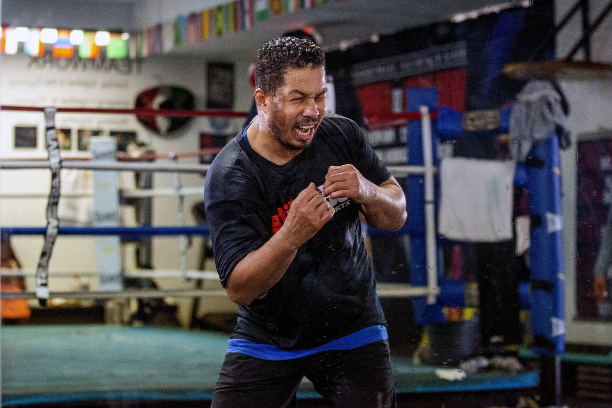 Hector Camacho, Jr. shadow boxes into a mirror in preparation for his exhibition bout against J ...