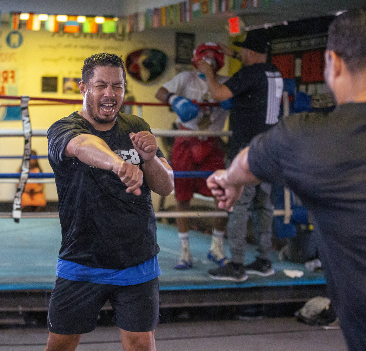 Hector Camacho, Jr. shadow boxes into a mirror in preparation for his exhibition bout against J ...