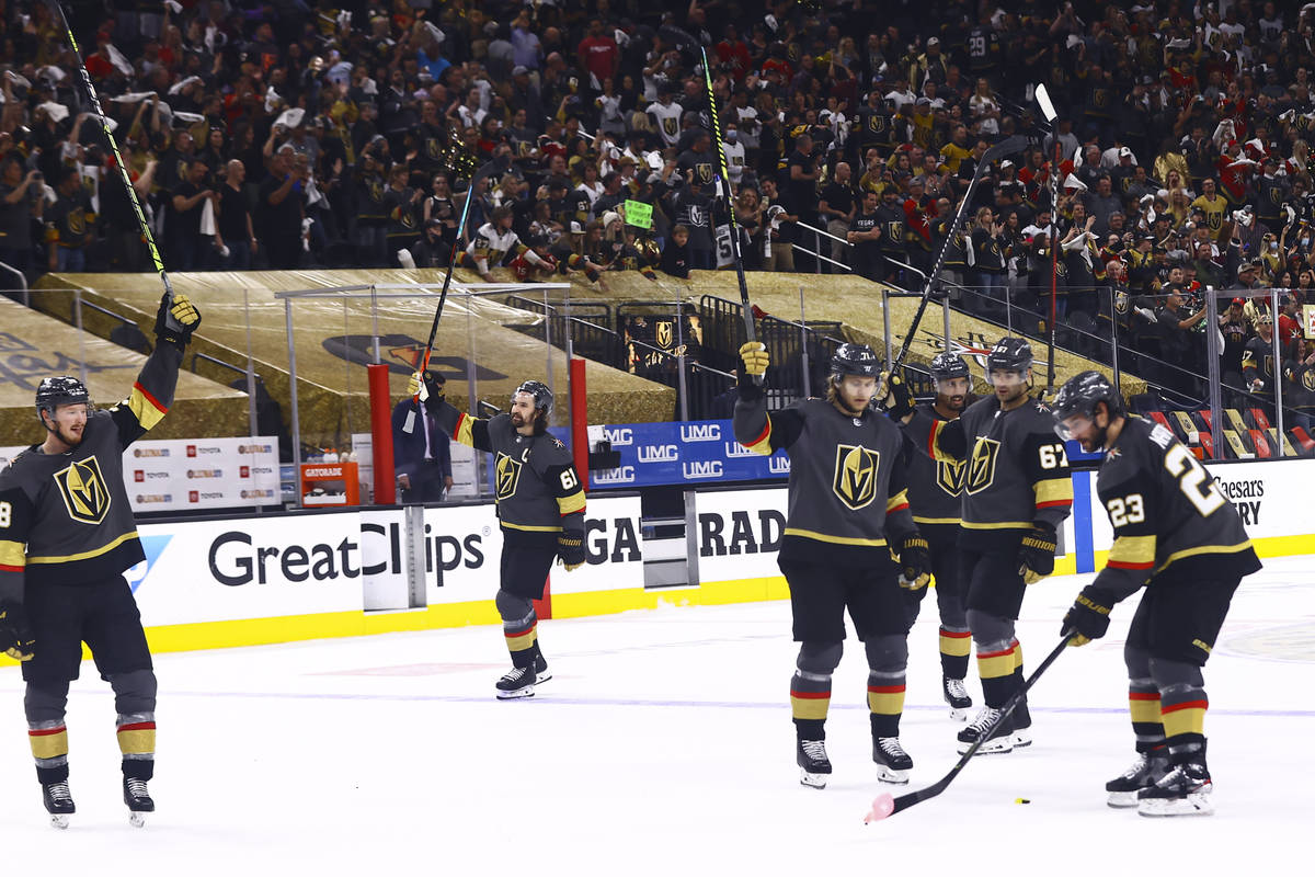 The Golden Knights celebrate after defeating Colorado Avalanche in Game 4 of an NHL hockey Stan ...