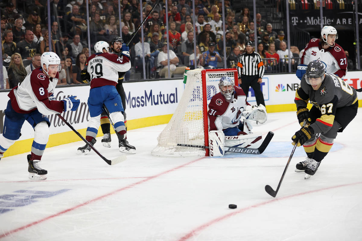Vegas Golden Knights left wing Max Pacioretty (67) and Colorado Avalanche defenseman Cale Makar ...