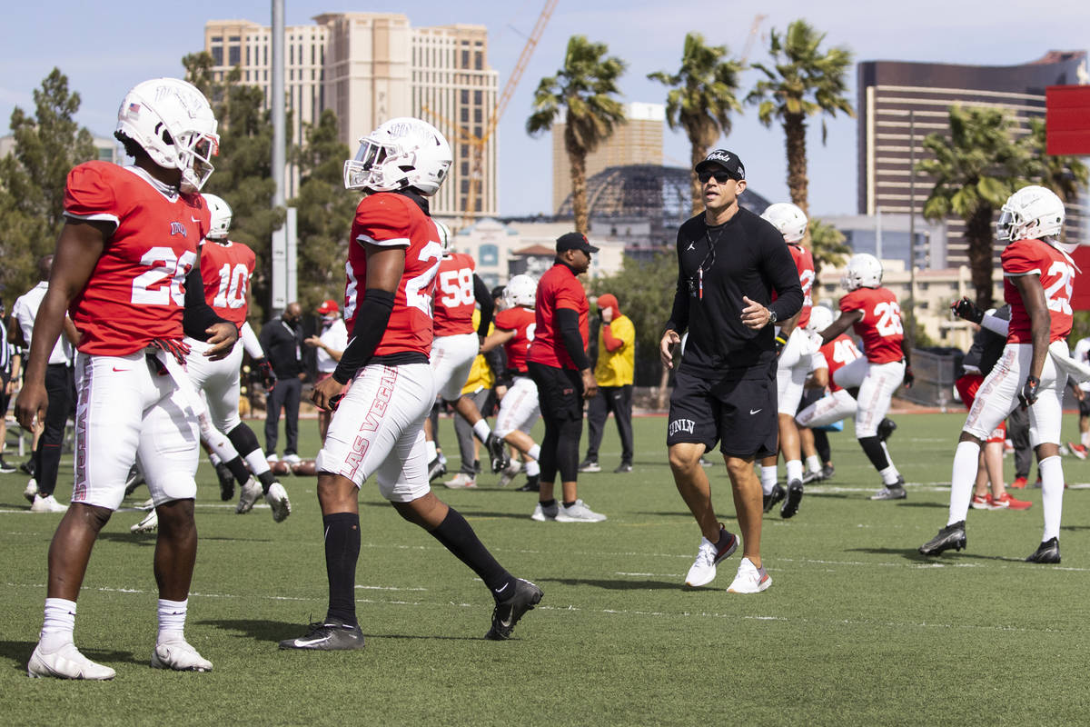 UNLV men's football head coach Marcus Arroyo watches his players during teamÕs practice on ...