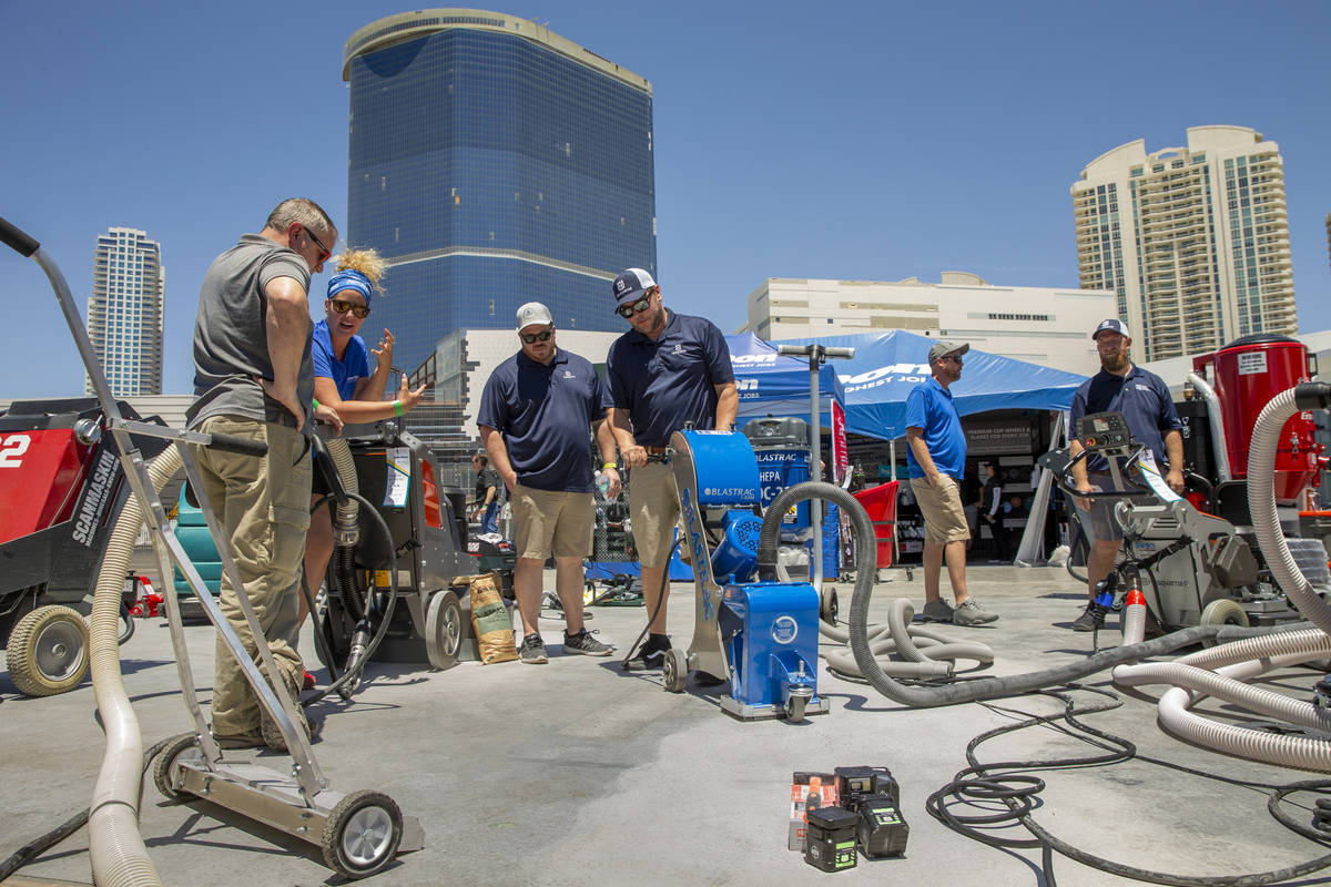 A Blastrac surface preparation machine is demonstrated at the Jon-Don display outside of the We ...