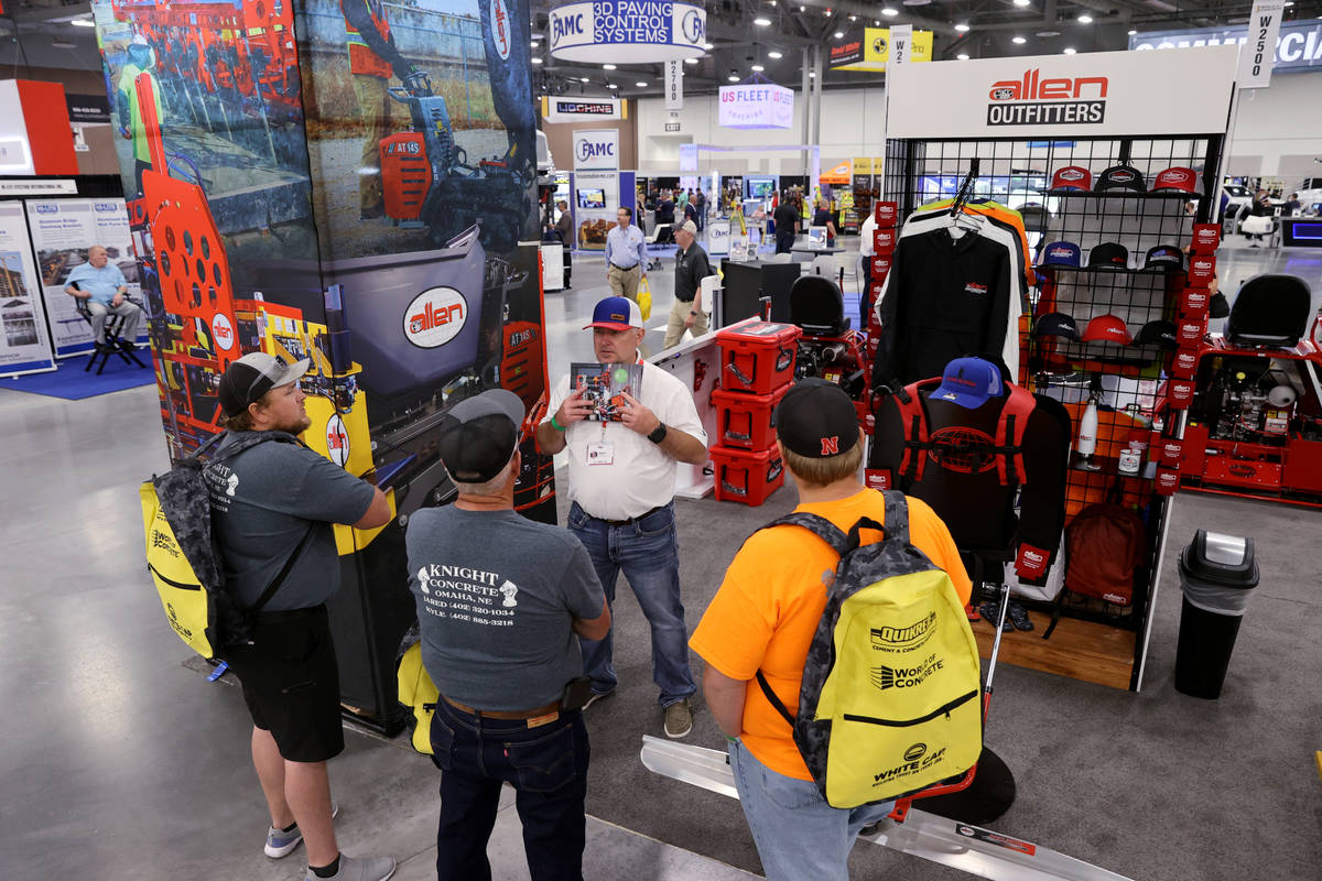 Allen Engineering Sales Representative Tim Duty talks to Jared Knight, from left, Ken Knight an ...