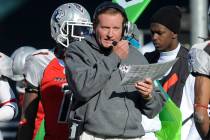 FILE - In this Nov. 27, 2010, file photo, then Las Vegas head coach Jim Fassel, center, looks o ...