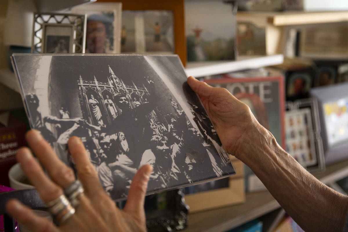 Judy Polumbaum holds a photograph taken by her father, news photographer Ted Polumbaum. The pho ...