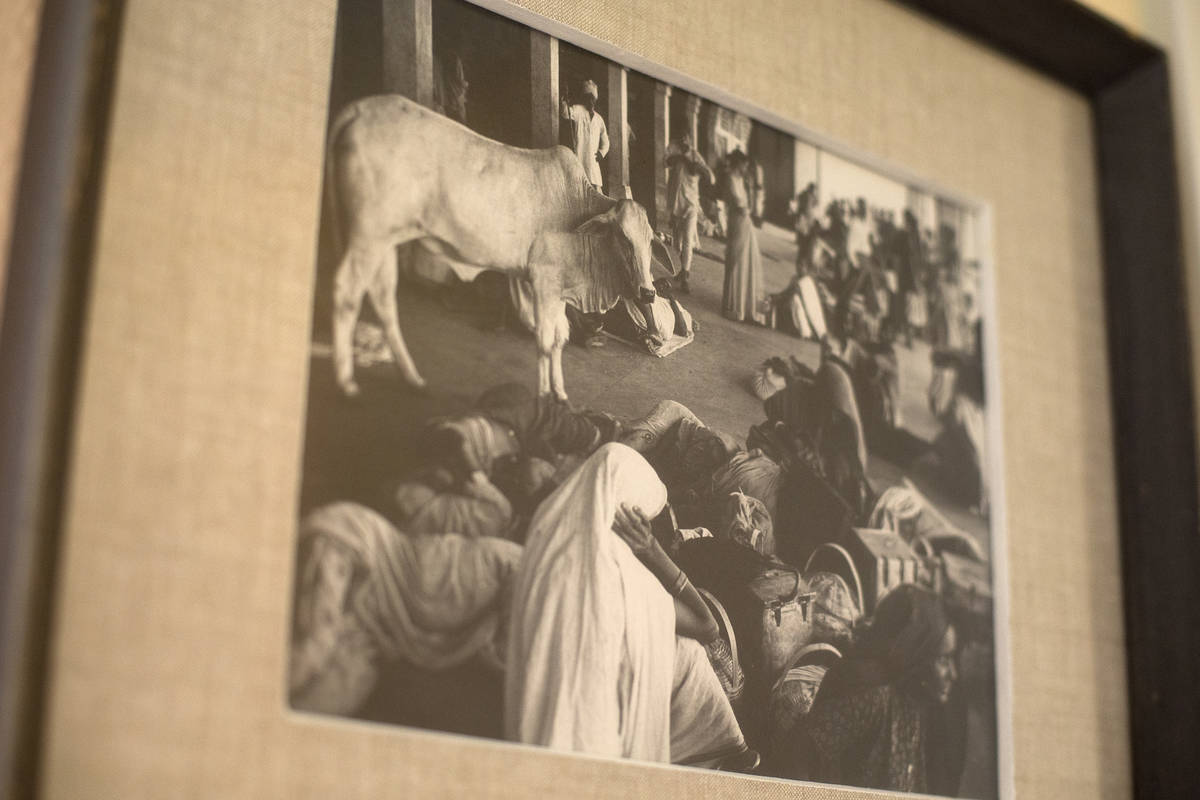 A photograph taken during Ted Polumbaum's travels in India hangs on his daughter Judy Polumbaum ...