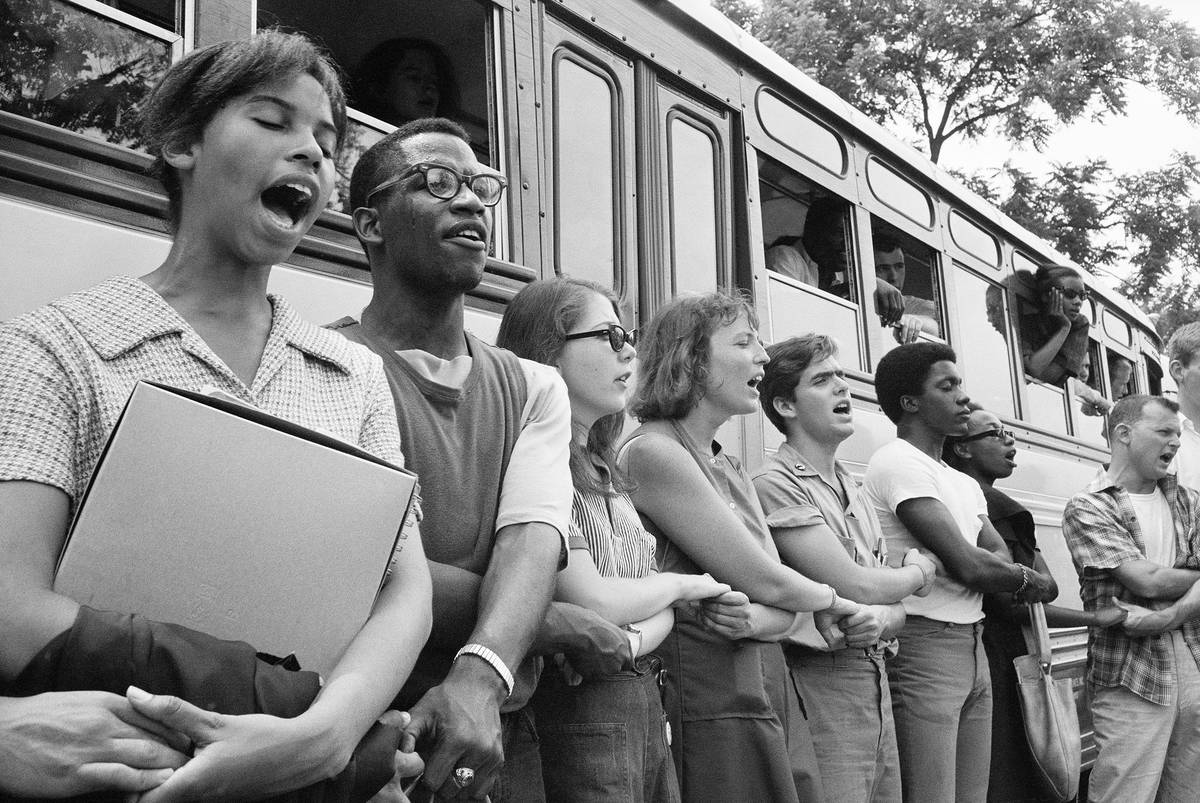 Singing “We Shall Overcome,” this group of volunteers begins its journey from Oxford, Ohio, ...