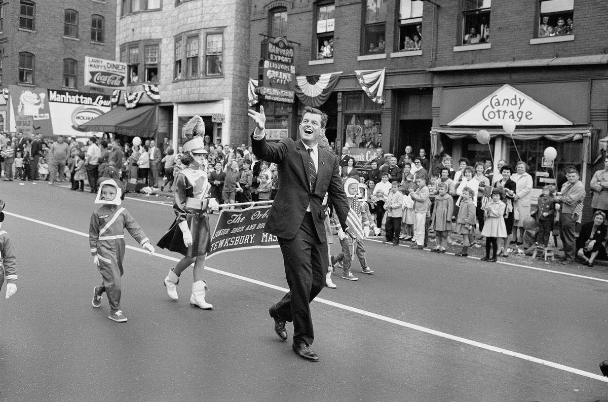 Members of the Tewksbury Drum and Bugle Corps and The Orbiters walk in a parade in 1962 in Lawr ...