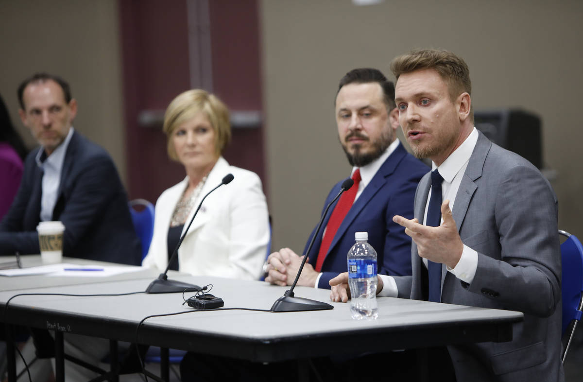 Jim Berchtold, attorney from Legal Aid Center of Southern Nevada, right, speaks during a Housin ...
