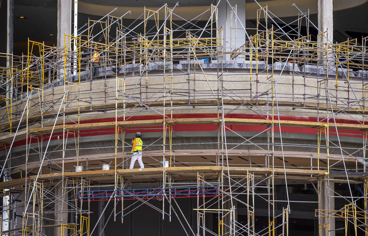 Crews work on the exterior of Resorts World as construction continues on Tuesday, April 27, 202 ...