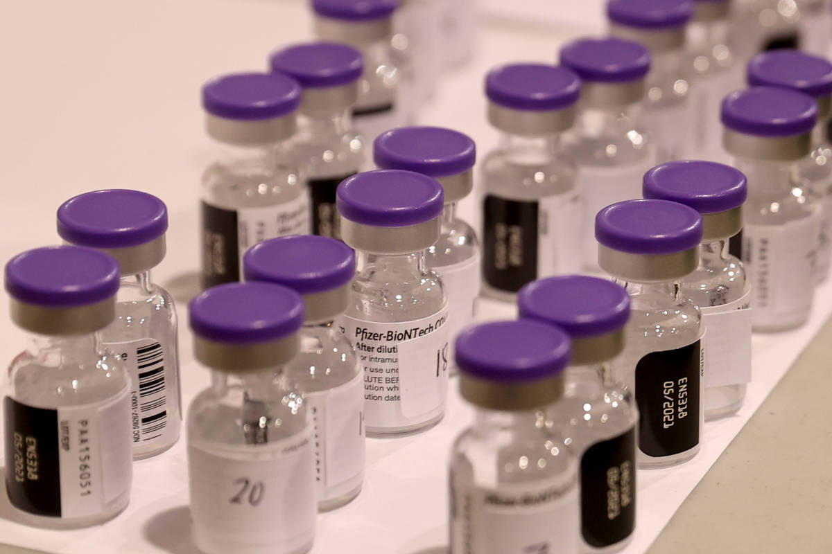 Pfizer vaccine is brought to room temperature at the Cashman Center COVID-19 vaccination site i ...