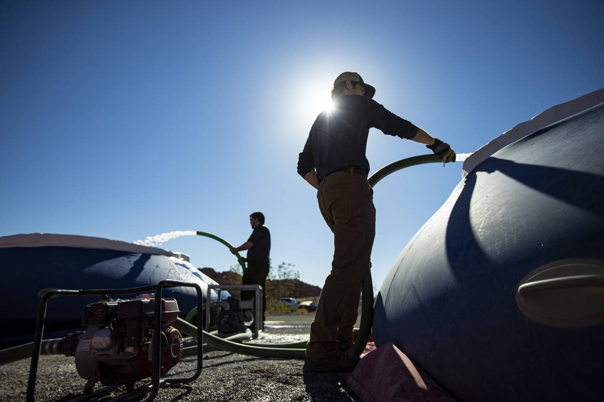Seth Wilson, a Lathrop-Capurro memorial intern with the Nevada Department of Wildlife, right, r ...