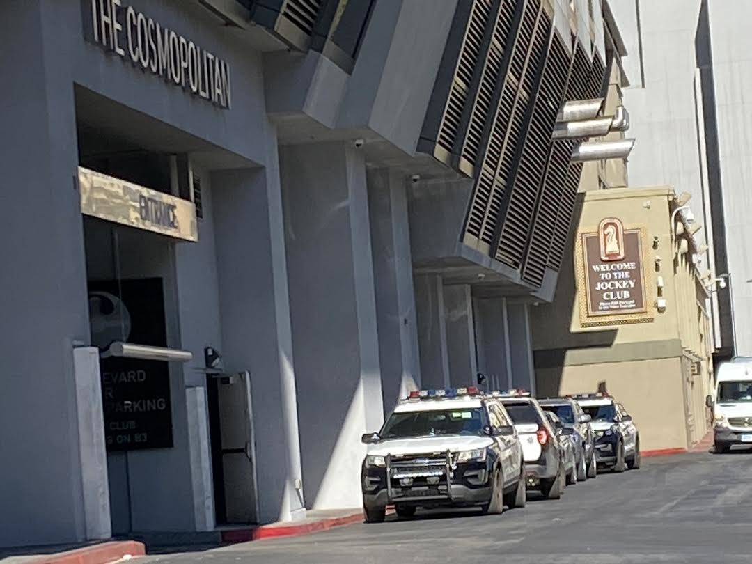 Las Vegas police cars sit outside The Cosmopolitan of Las Vegas following a robbery at the casi ...