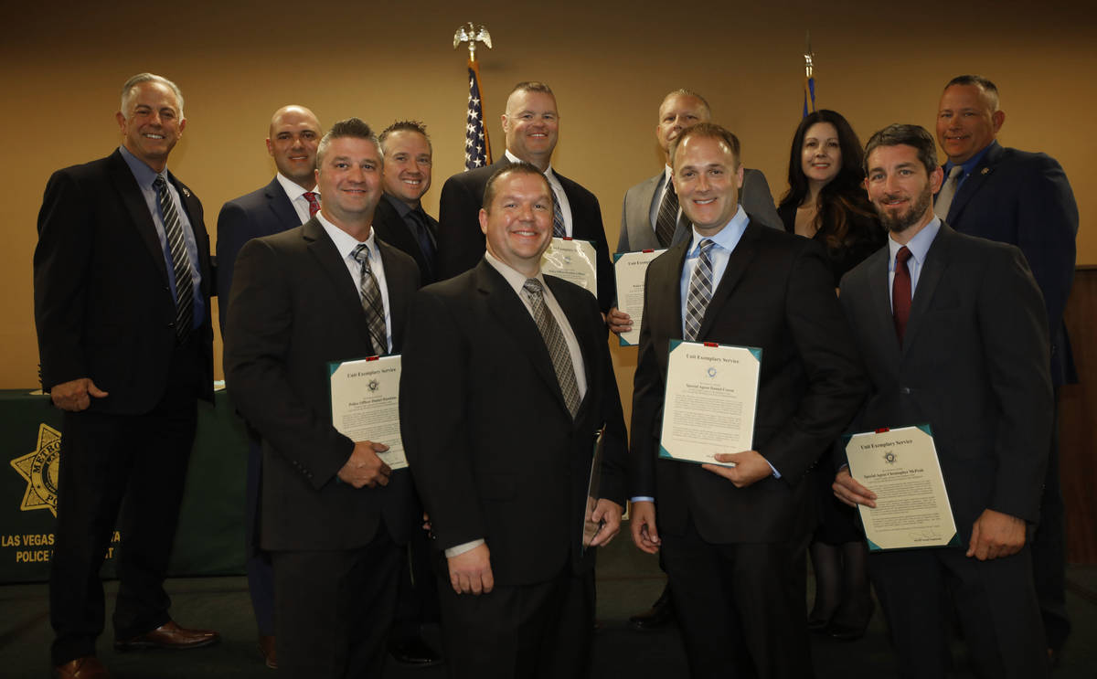 Clark County Sheriff Joe Lombardo, left, poses for a photo with the recipients of unit exemplar ...