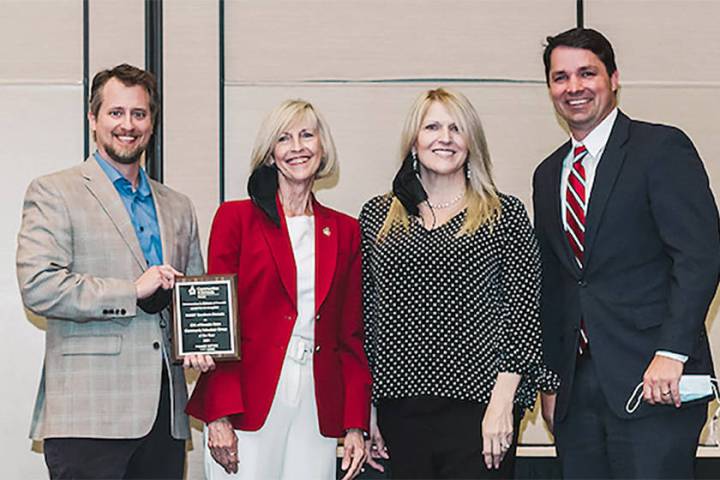 Communities in Schools of Southern Nevada Executive Director Cheri Ward, second from left, pres ...