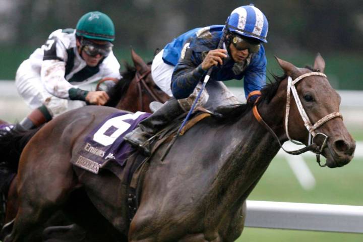 FILE - In this Saturday, Oct. 27, 2007 file photo, Lahudood of Great Britain, right, ridden by ...