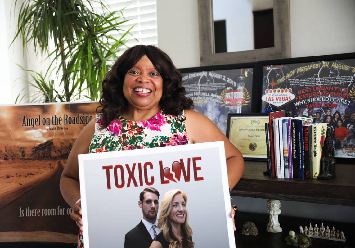Tamia Dow is surrounded by posters and awards for her films at her friend's home in Las Vegas W ...