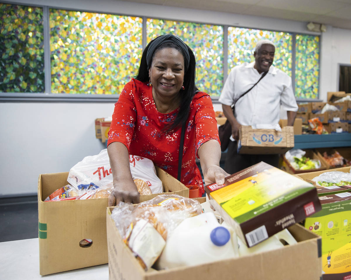 Linda, left and husband Jimmy Stewart shop at the food bank at City Impact Center on Tuesday, J ...