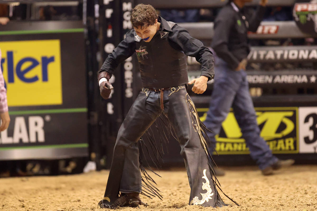 Bull rider Austin Richardson reacts after his run during the Professional Bull Riders Las Vegas ...