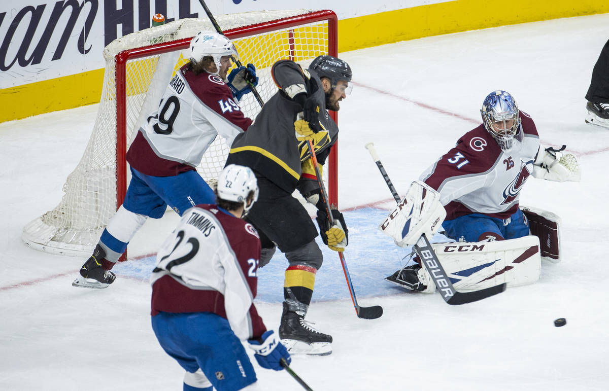 Golden Knights left wing William Carrier (28) readies to score over Colorado Avalanche goaltend ...