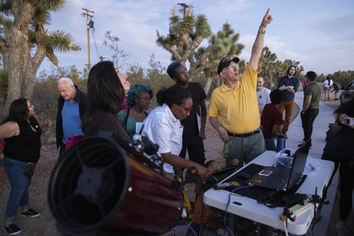 Bill Krause, with the Las Vegas Astronomical Society, shows attendees the photos he's taken wit ...
