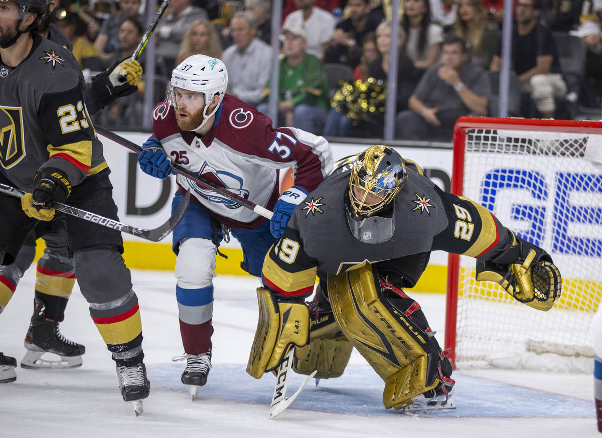 Colorado Avalanche left wing J.T. Compher (37) and Golden Knights goaltender Marc-Andre Fleury ...