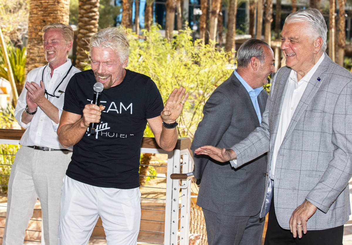 Sir Richard Branson, second from left, founder of Virgin Group, shares a laugh with Gov. Steve ...