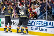 Golden Knights right wing Ryan Reaves (75) celebrates a goal with teammates left wing William C ...