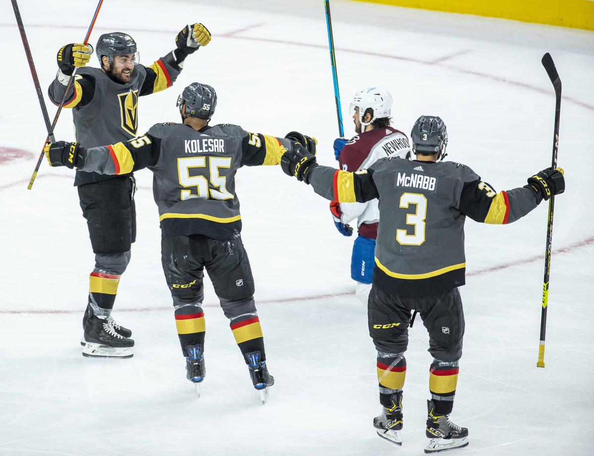Golden Knights left wing William Carrier (28) celebrates his score with teammate right wing Kee ...