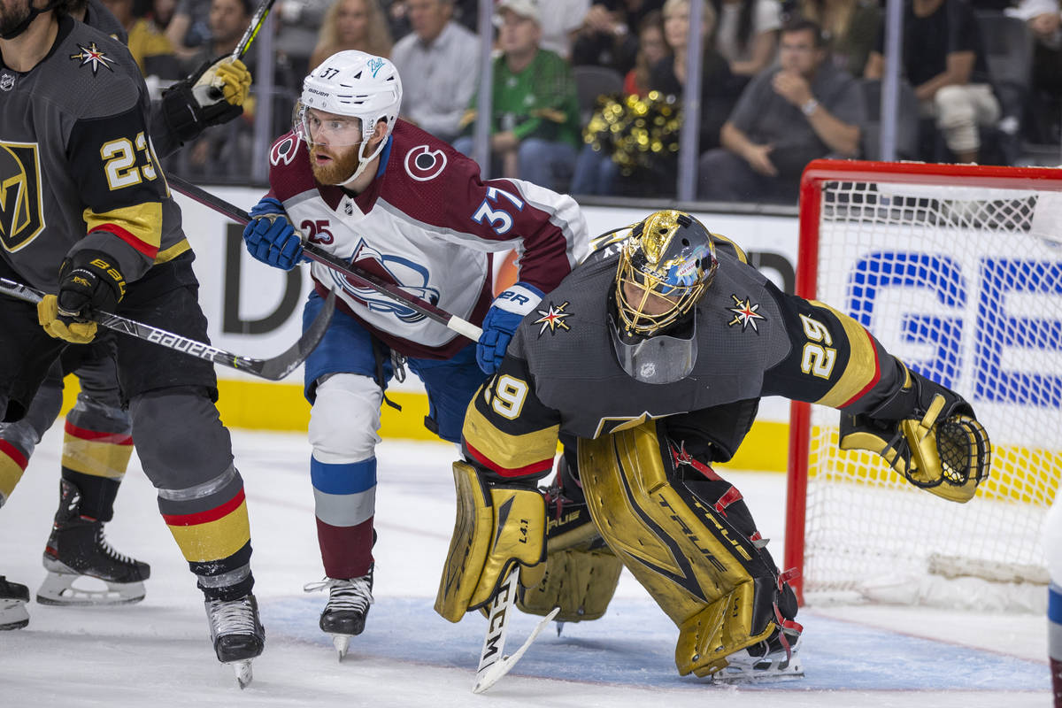 Colorado Avalanche left wing J.T. Compher (37) and Golden Knights goaltender Marc-Andre Fleury ...