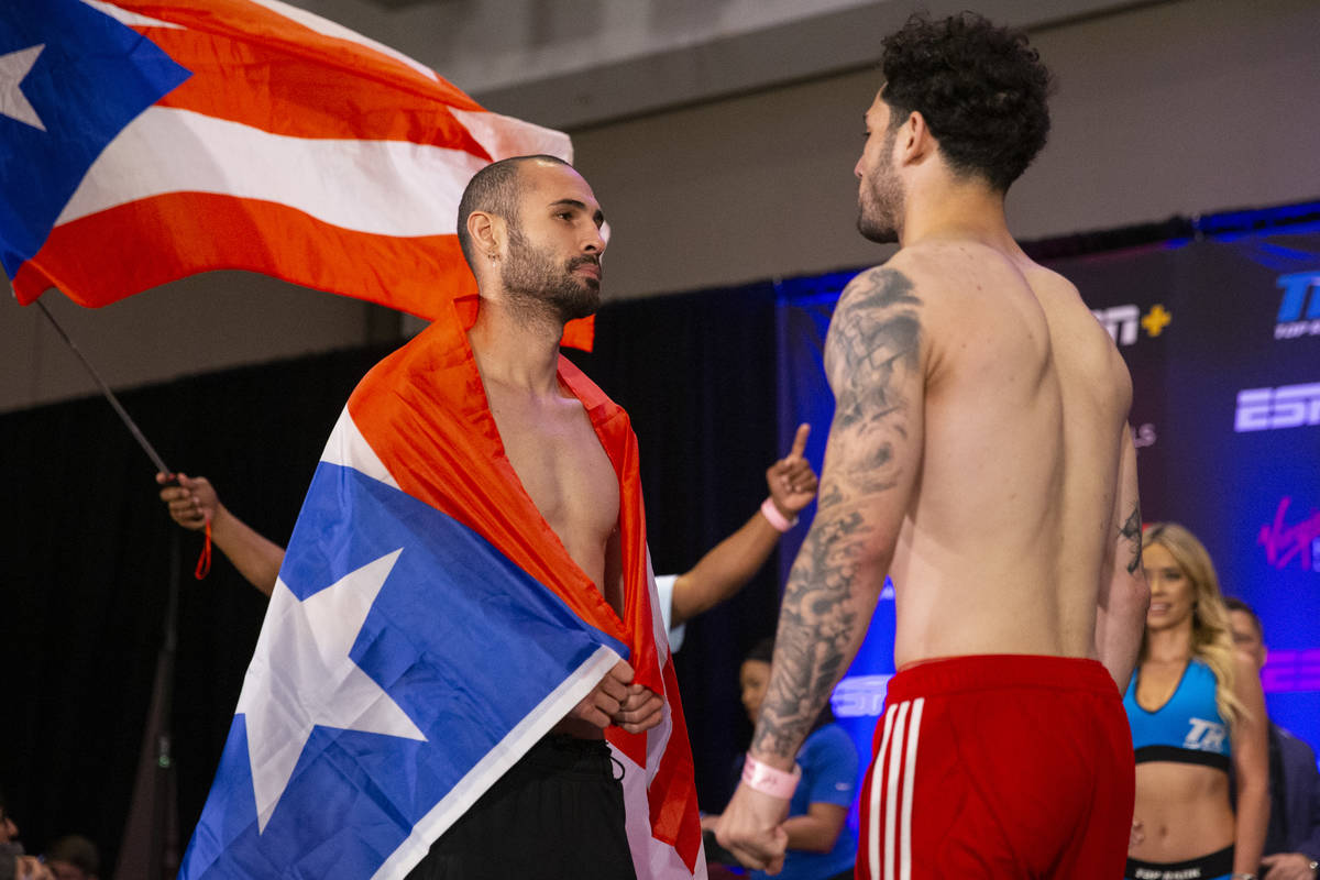 Jose Pedraza, left, and Julian Rodriguez, face off during a weigh-in event at the Virgin Hotels ...