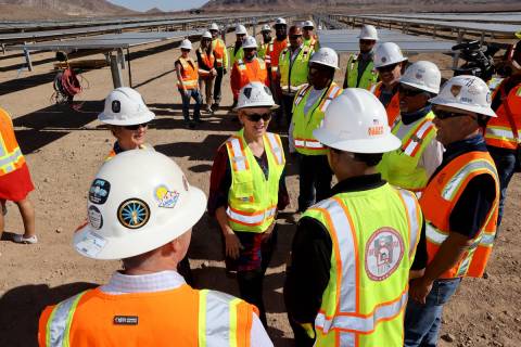 U.S. Energy Secretary Jennifer Granholm, center, visits with IBEW Local 357 workers at Townsite ...
