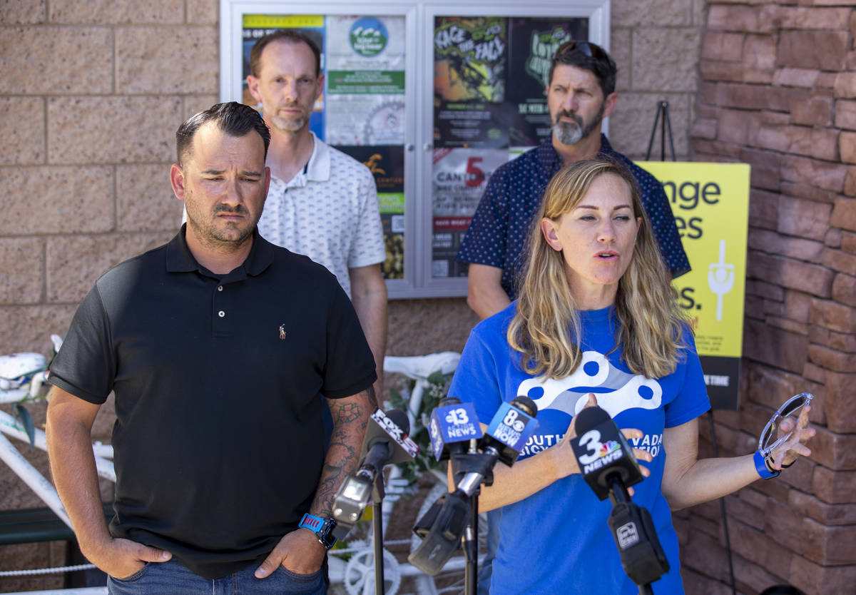 Rob Hutchinson, President of the Southern Nevada Bicycle Coalition, left, and Keely Brooks talk ...