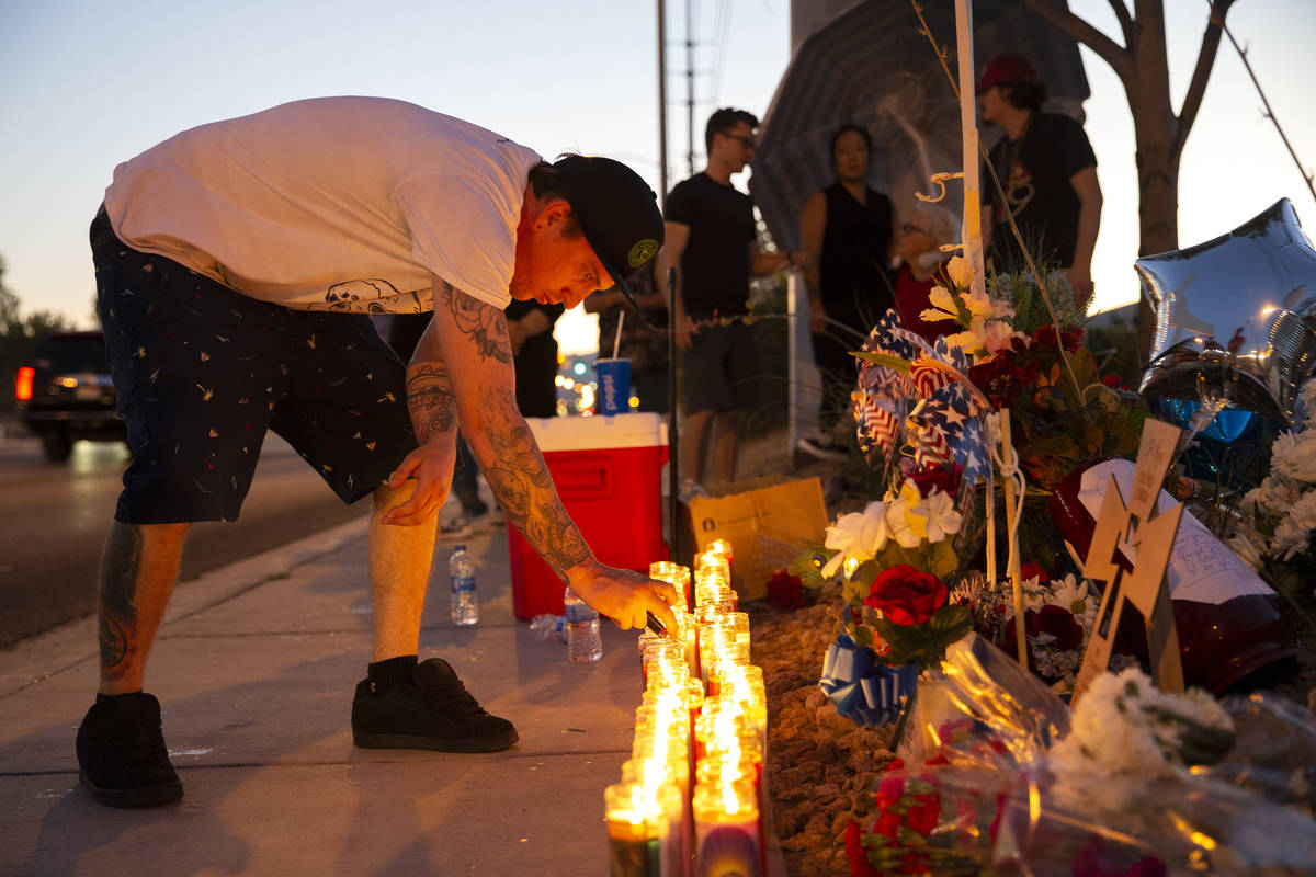 Sheldon Cooper, a close friend of Walter Anderson's son Ryan, keeps the candles lit at a vigil ...