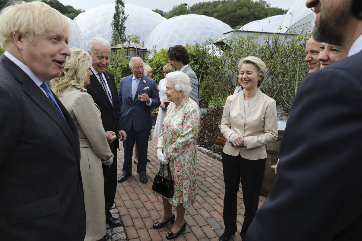Britain's Queen Elizabeth II speaks to President Joe Biden and his wife Jill Biden during recep ...