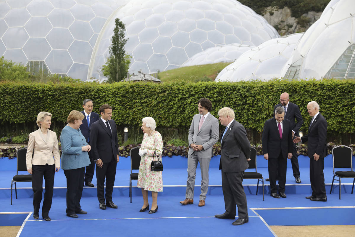 Britain's Queen Elizabeth II talks with G7 leaders, from left, back row, President of the Europ ...